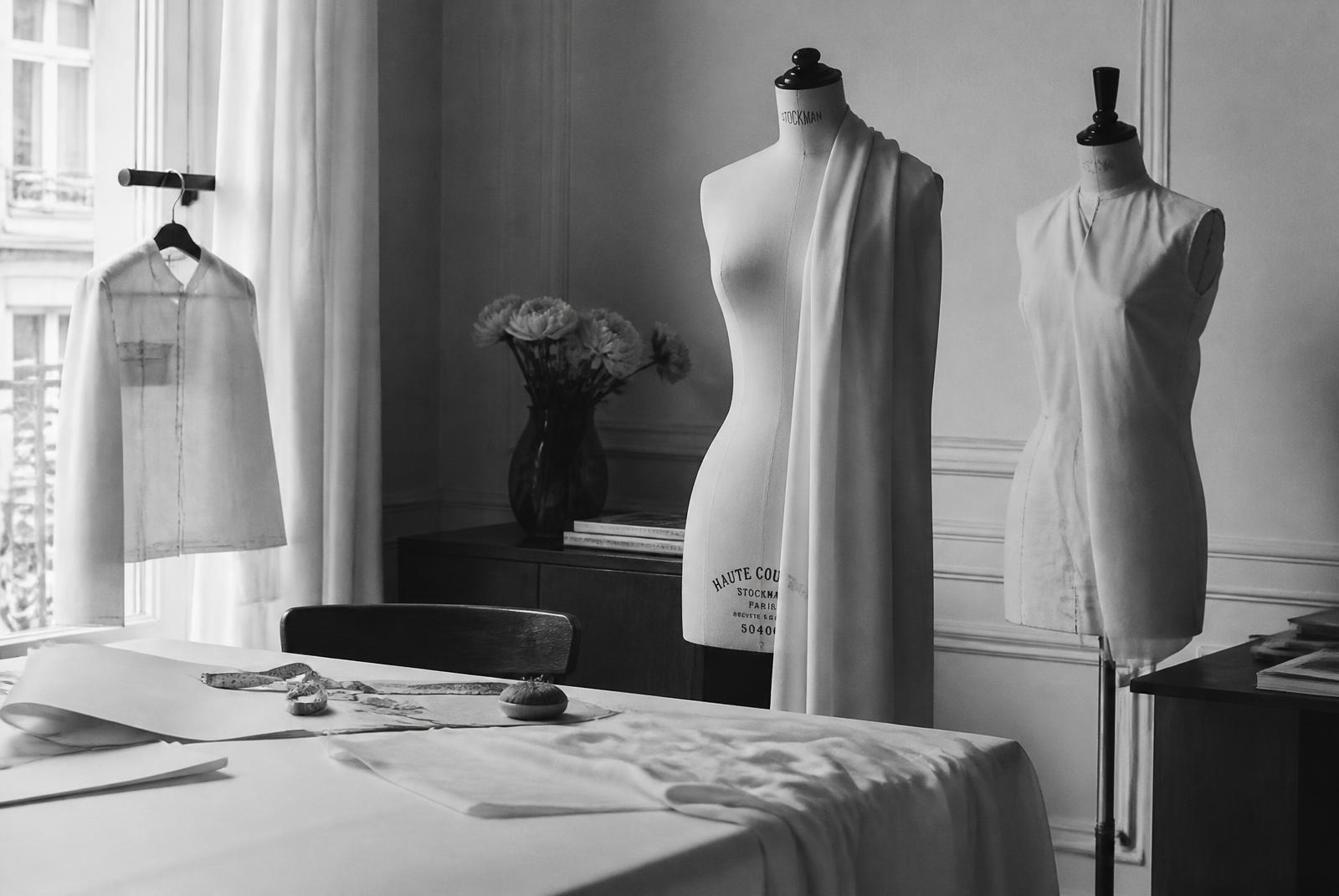 Atelier interior with dress forms and draped fabric
