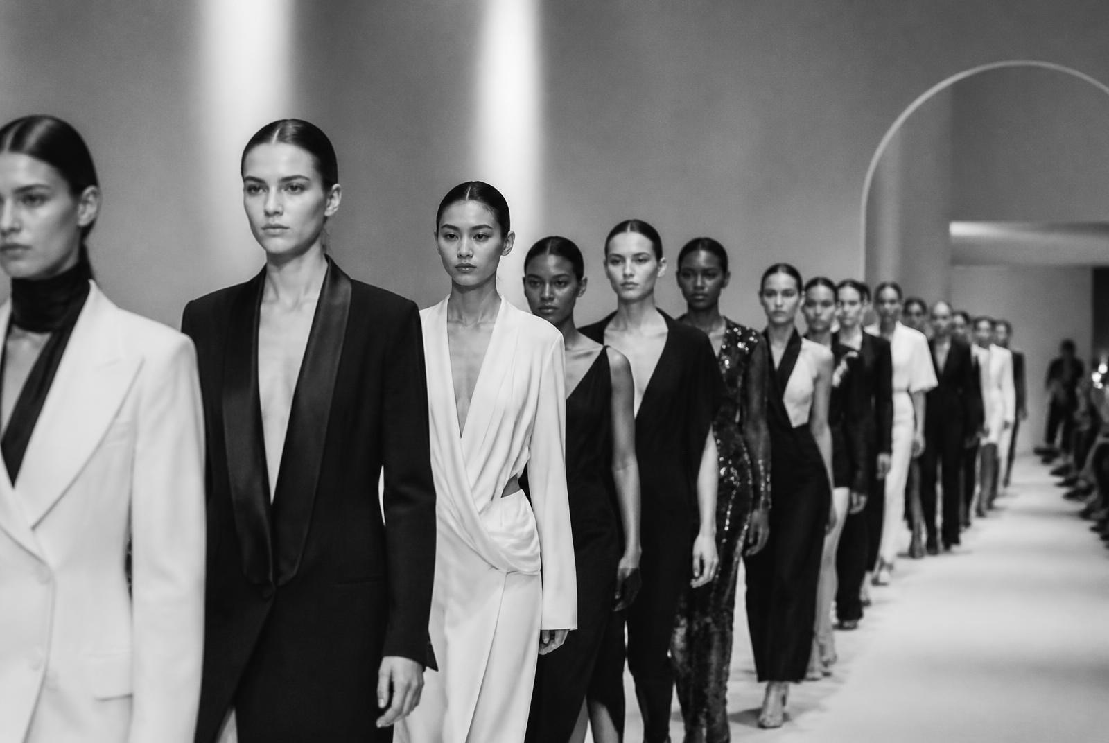 Models presenting a collection during a produced runway show
