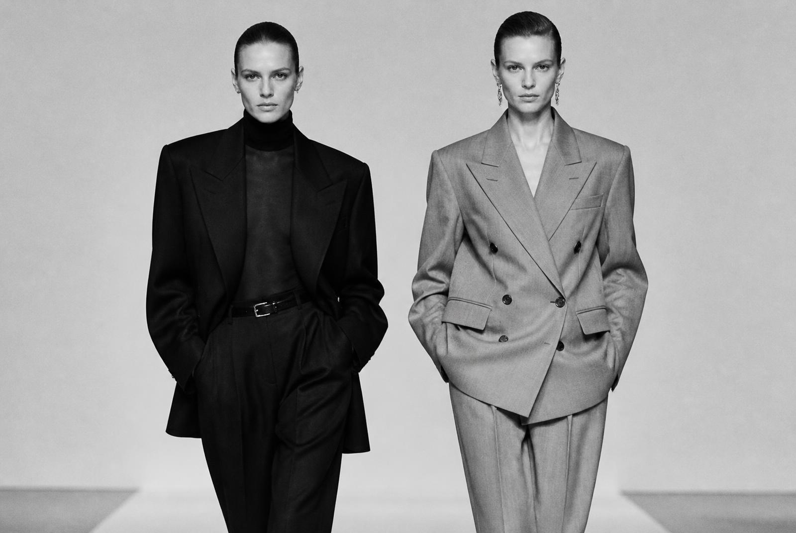 Two models in tailored looks on a minimal runway